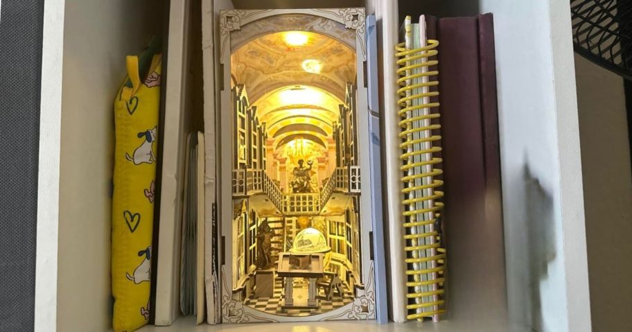 library book nook kit on shelf between books