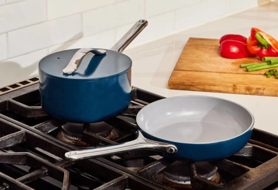 two blue mini pots and pans