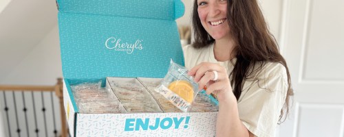 woman holding box of cheryls cookies