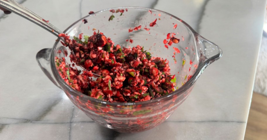 chopped cranberries and jalapeños in a mixing bowl