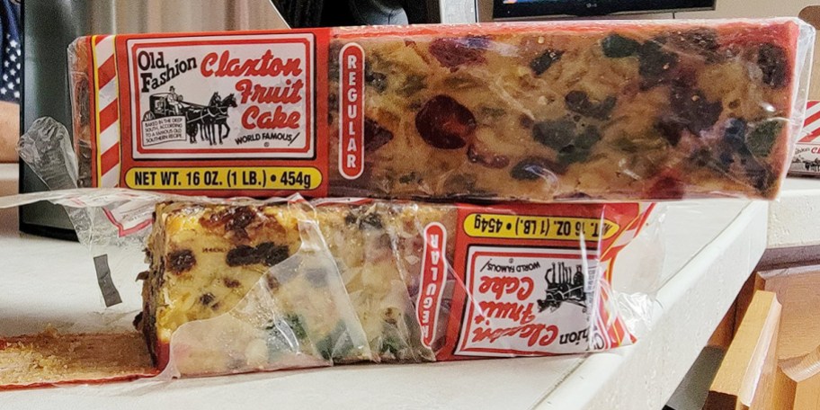 two fruit cakes stacked on counter