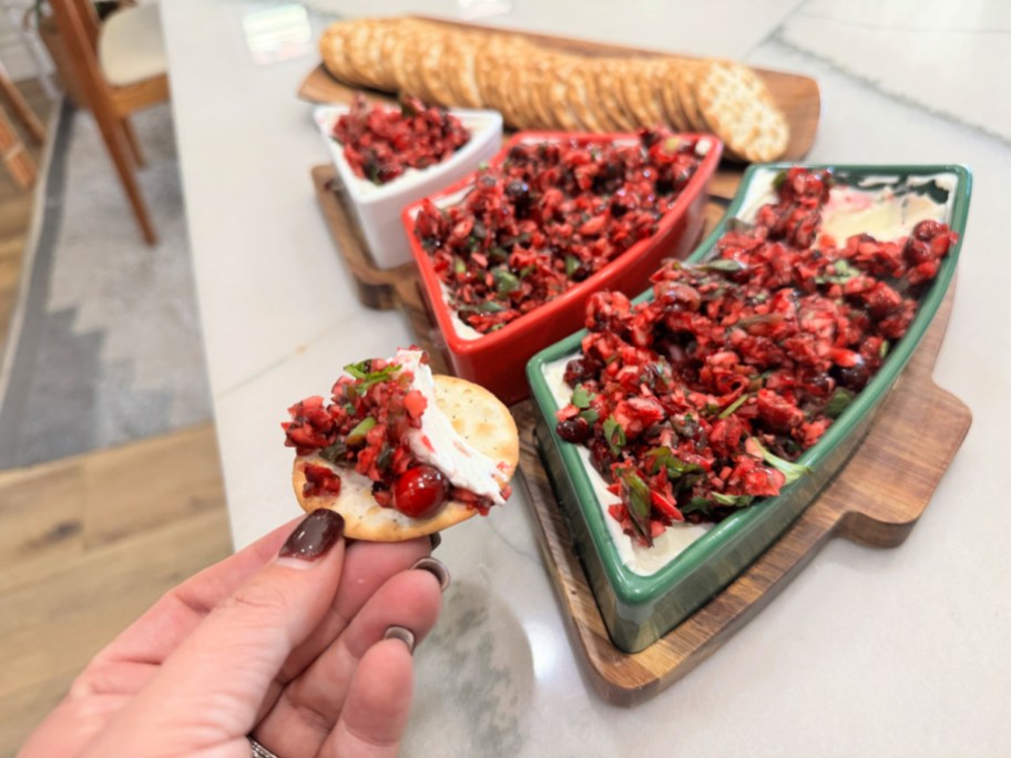 cranberry jalapeno dip spread on a water cracker