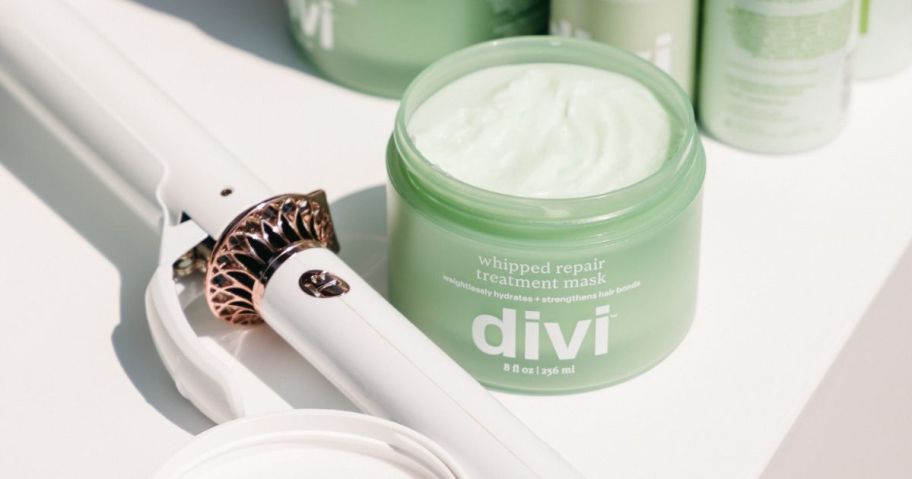 Divi Whipped Repair Hair Treatment Mask Deep Conditioning Hair Mask next to curling iron on counter