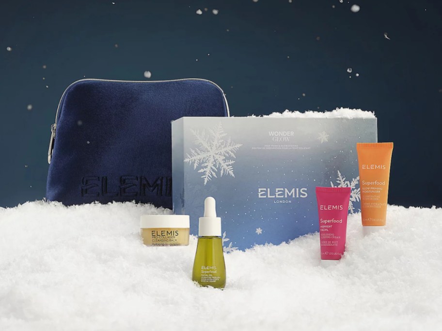 An ELMIS skincare gift set in a bed of snow.