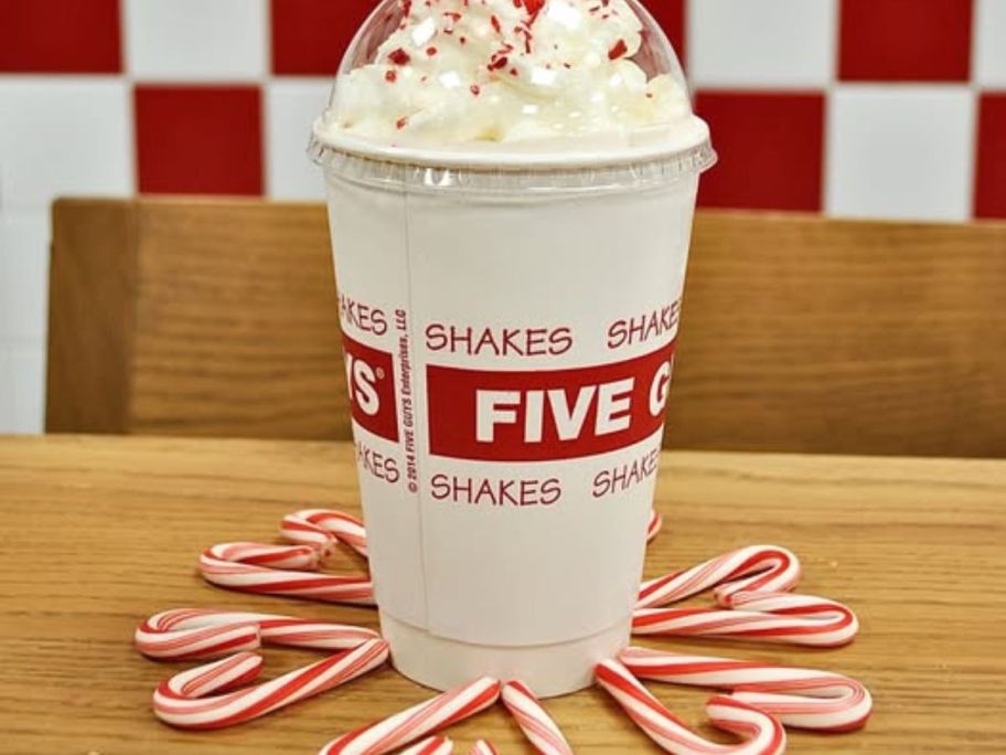 five guys shake with candy canes around it