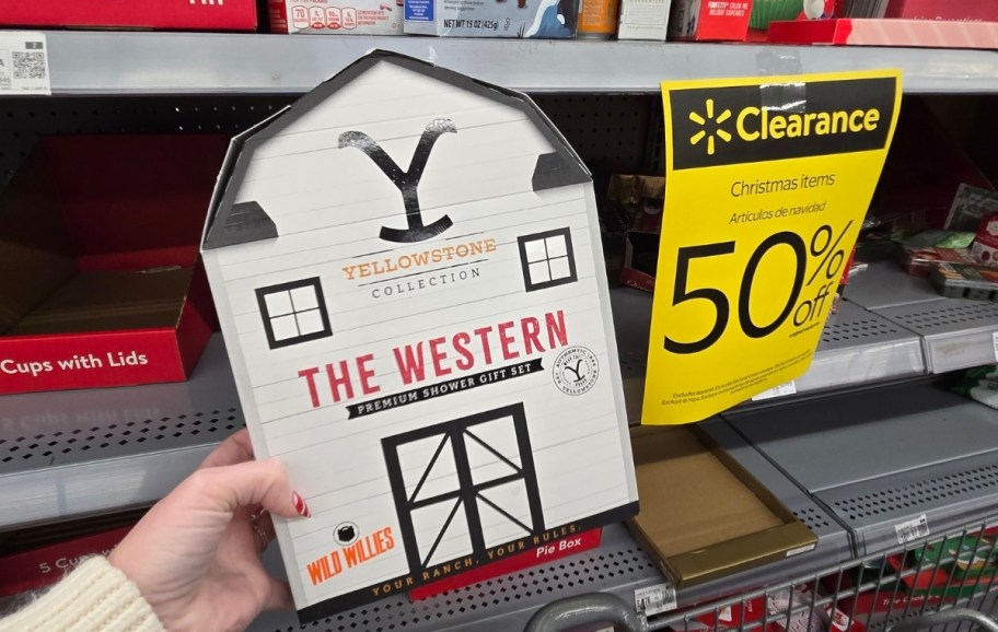 womans hand holding a shower gift set 