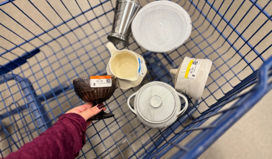 goodwill basket with ceramic and glass vessels from Goodwill