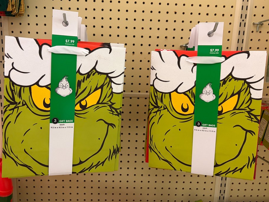 grinch gift bags hanging in store 