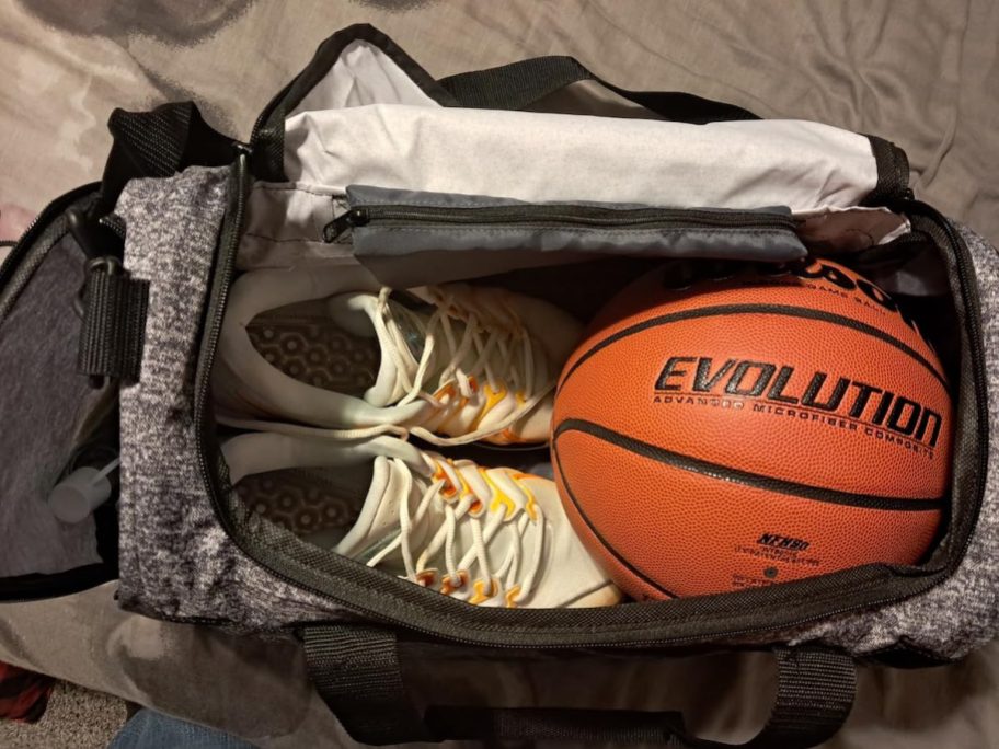 open gym bag with basketball and sneakers inside