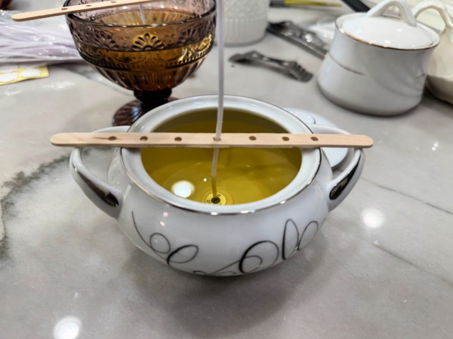 homemade with a wick and holder on top