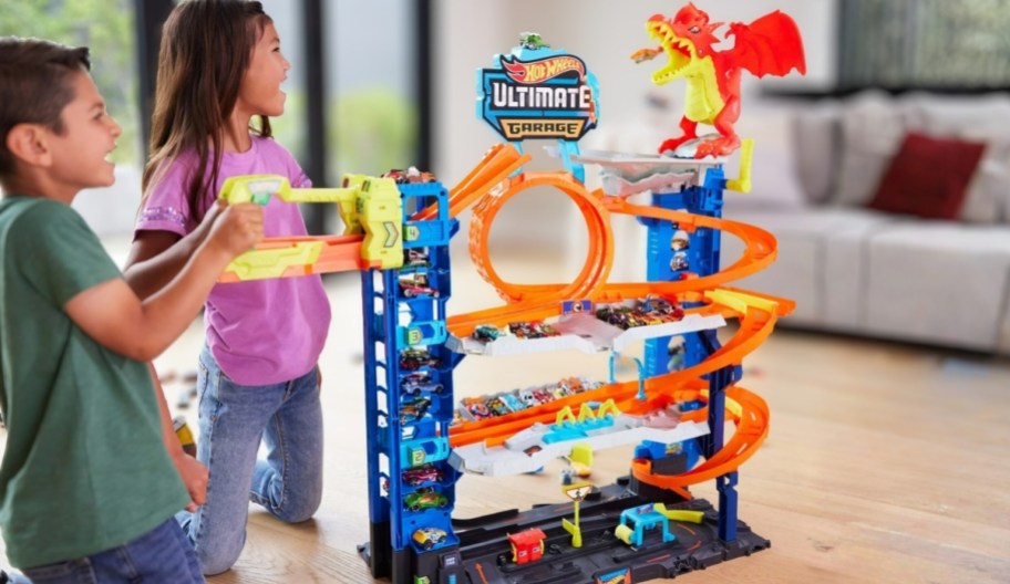kids playing with a hot wheels ultimate garage