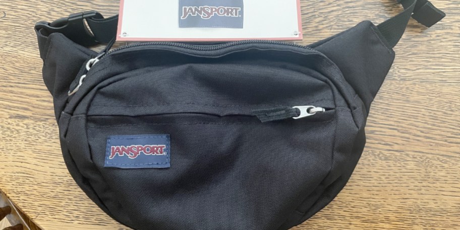 black crossbody laying on table