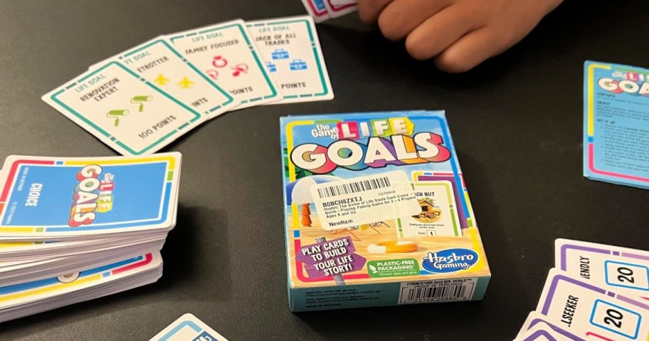 the game of life goals card game on a table