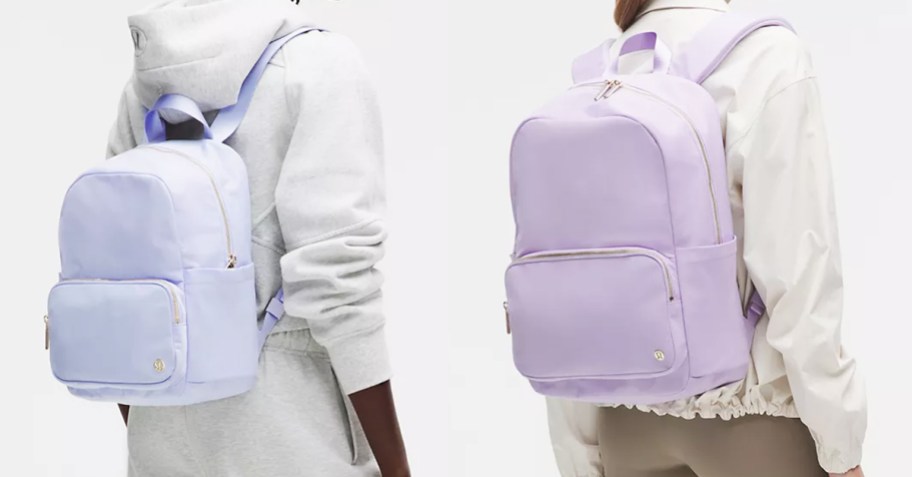 two women with light purple backpacks