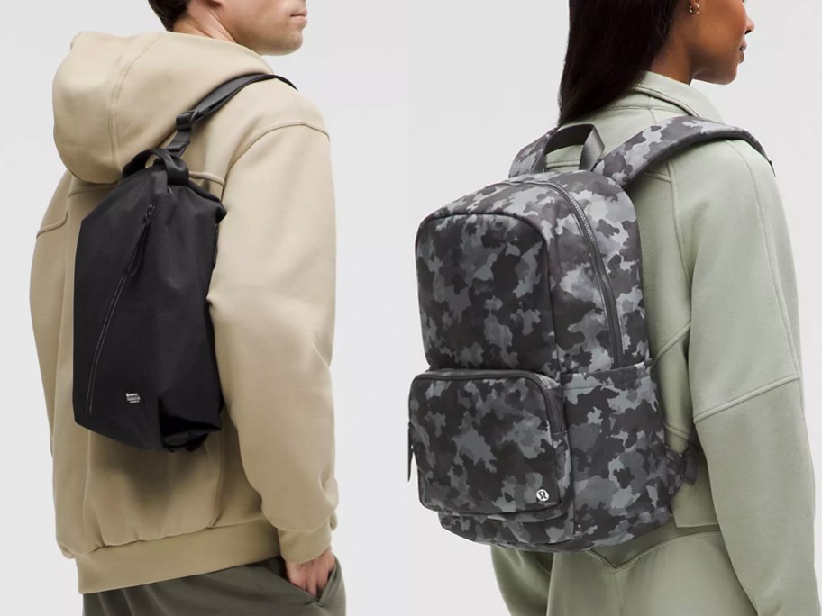 man wearing black backpack and woman wearing camo one