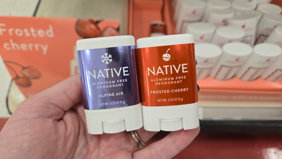 hand holding mini native deodorants