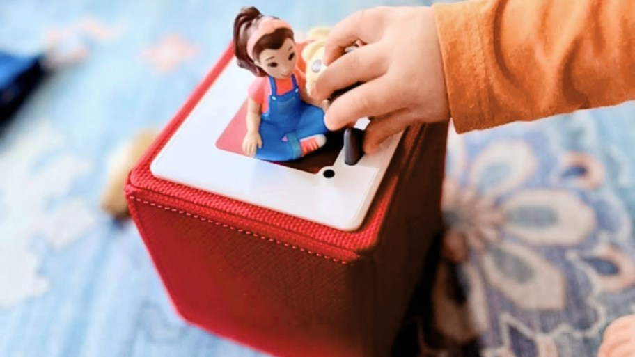 Baby's hand touching teacher Rachel Tony's box