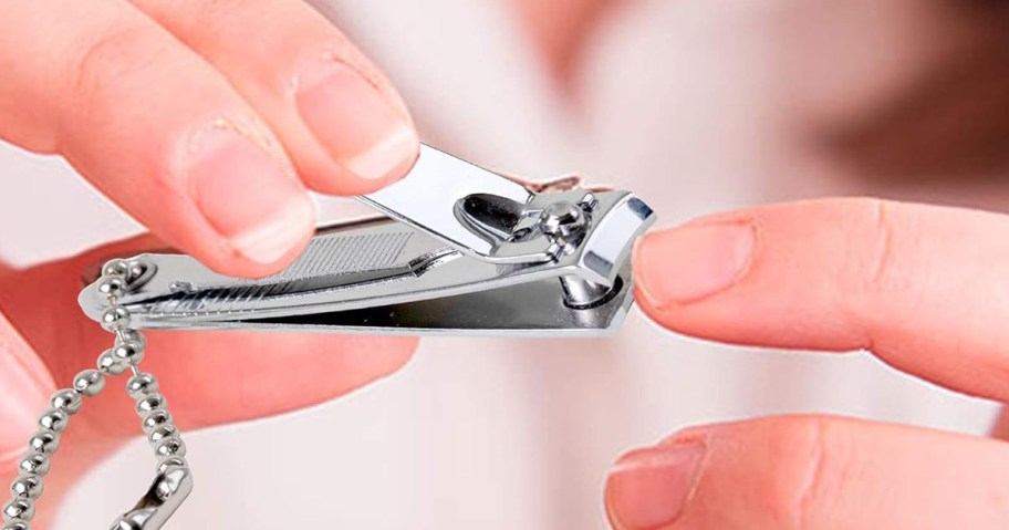 person using fingernail clippers