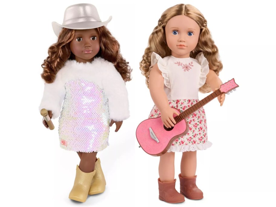 Two dolls dressed in country-themed outfits. The first wears a white, sparkly dress, fur coat, gold boots, and a silver hat, holding a microphone. The second has a floral skirt, white blouse, brown boots, and holds a pink guitar.