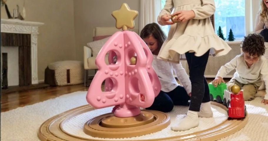 kids playing with Step2 My First Christmas Tree in living room