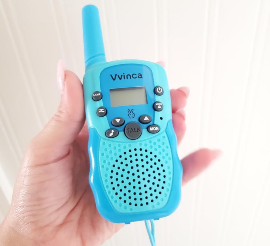 hand holding blue rechargeable walkie talkie
