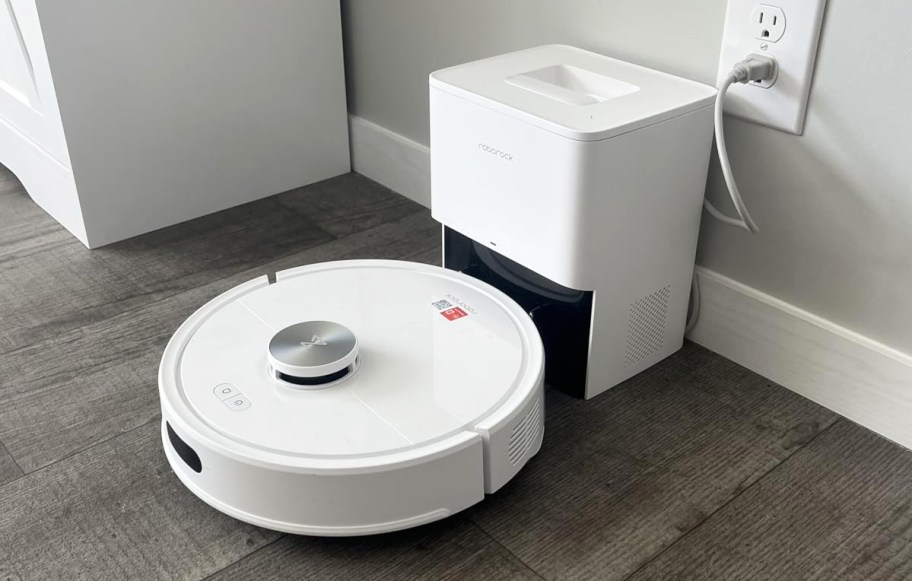 white robot vacuum on its charging base