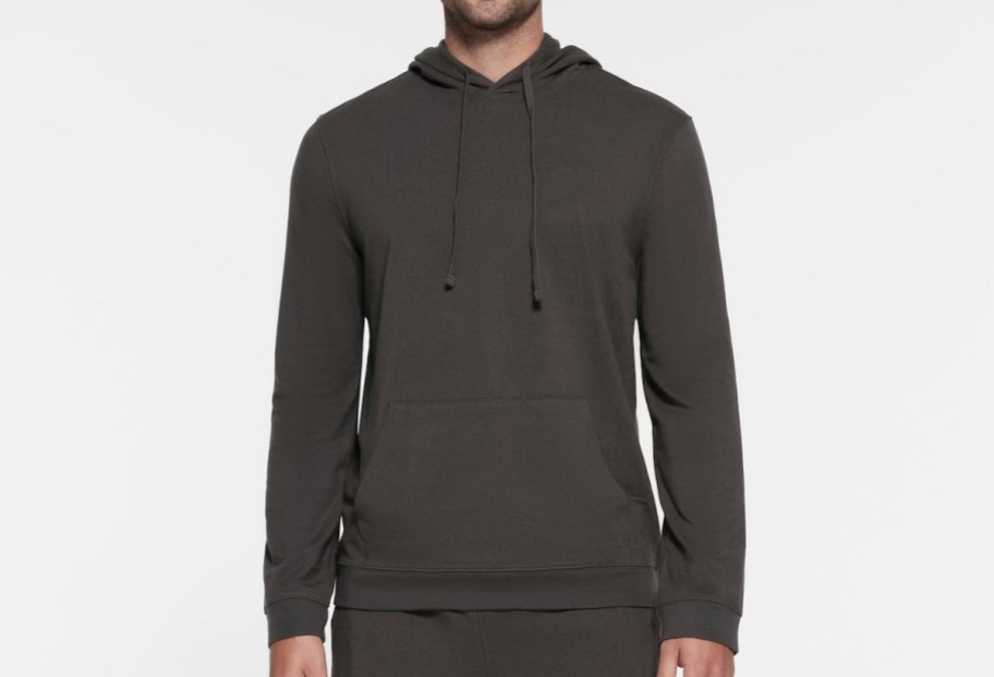 man wearing gray hoodie stock photo