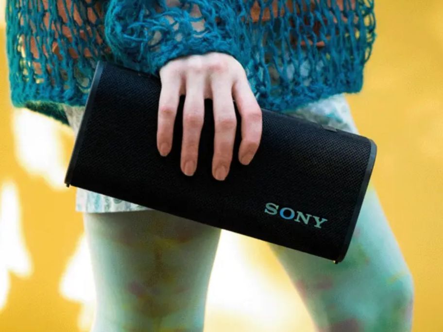 person holding Sony ULT FIELD 3 Wireless Portable Speaker