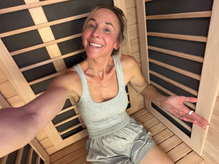 woman sitting inside sauna