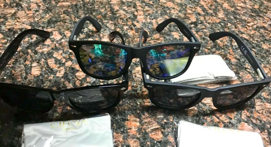 three different sunglasses on top of the table 