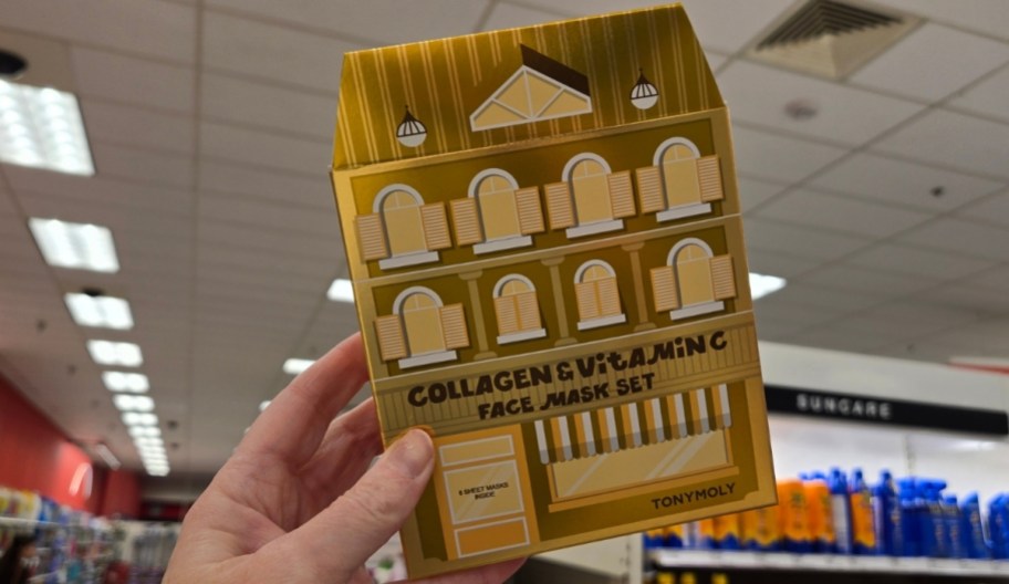 woman holding TONYMOLY Vitamin C & Collagen Sheet Mask Gift Set in target store