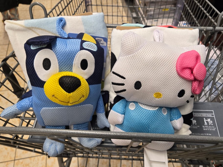 Two character bath towel sets in a cart at Aldi.