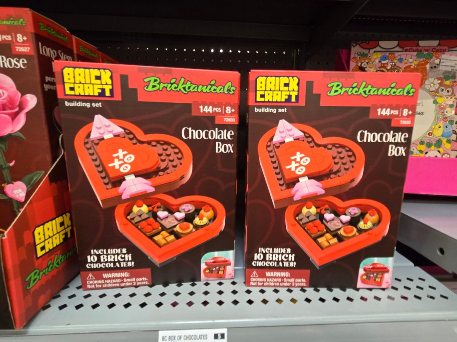 Two boxes of chocolate box Valentine's Day Brickcraft Bricktanicals sets on a shelf.