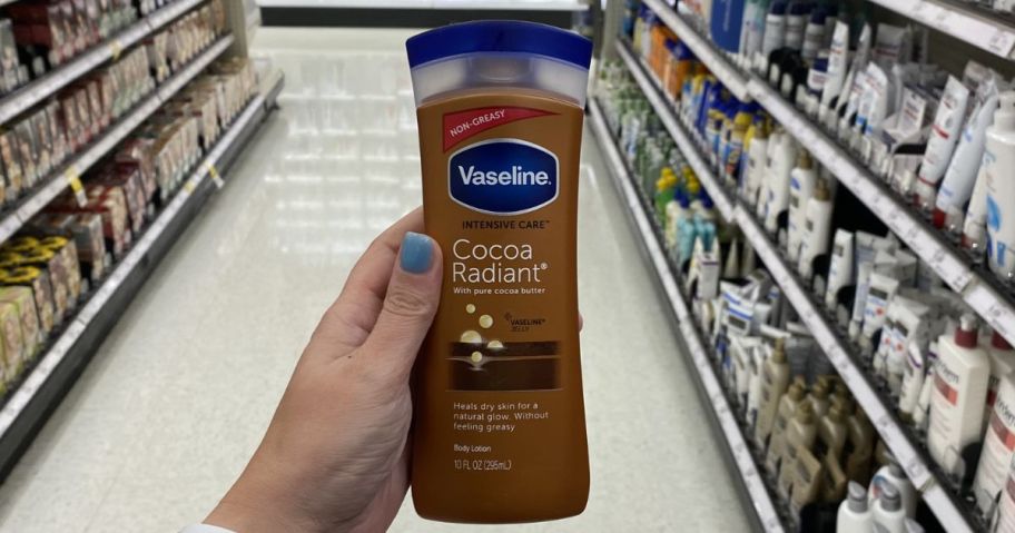 Vaseline Intensive Care Moisturizing Body Lotion 10oz Bottle in hand in store