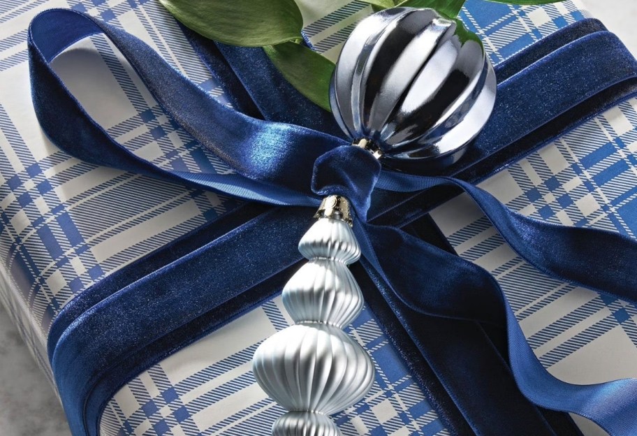 Close-up of velvet ribbon tied around a wrapped gift