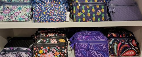 vera bradley bags on shelf in store