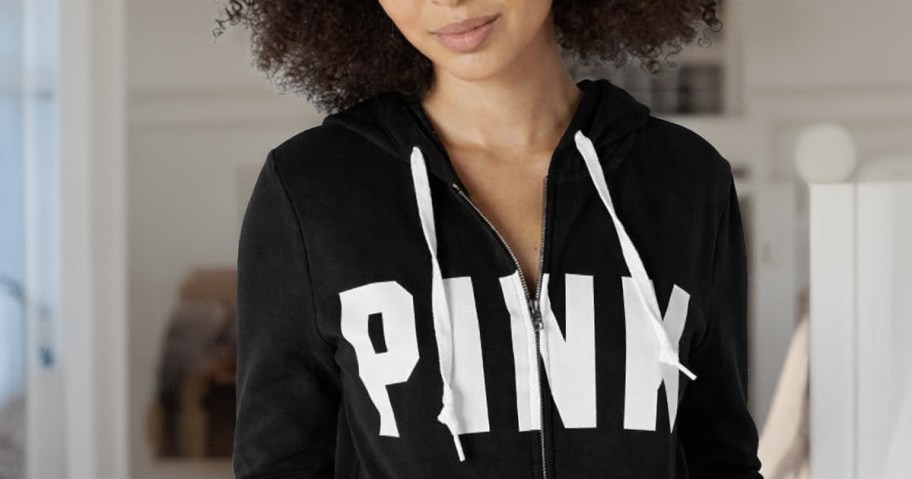 woman wearing victoria's secret pink hoodie