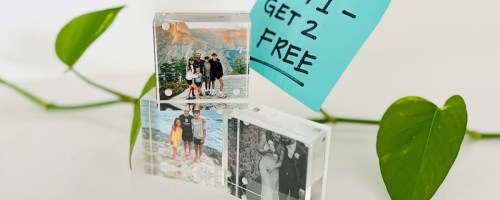 three photo blocks stacked on table