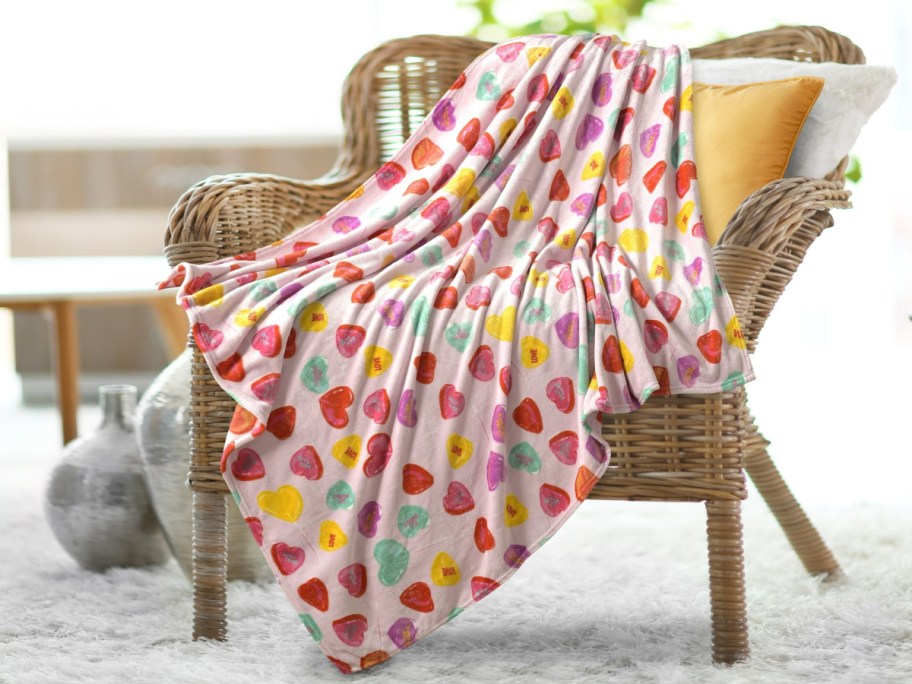 A Valentine's throw blanket with colorful hearts.