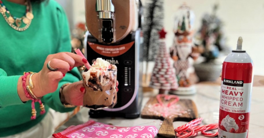 woman holding a peppermint mocha frappe using ninja slushie