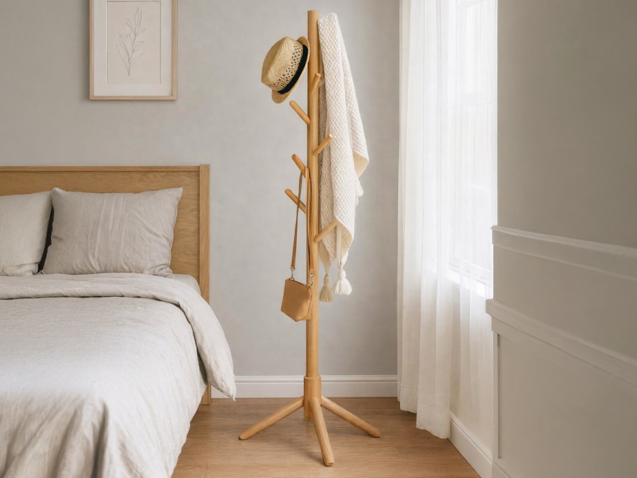 wooden coat rack in a bedroom