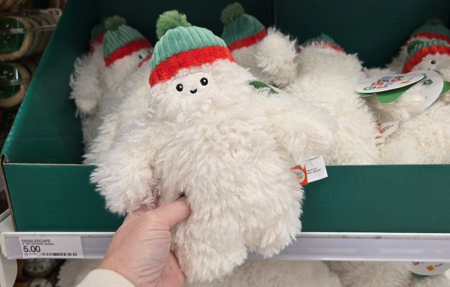 hand holding plush yeti 