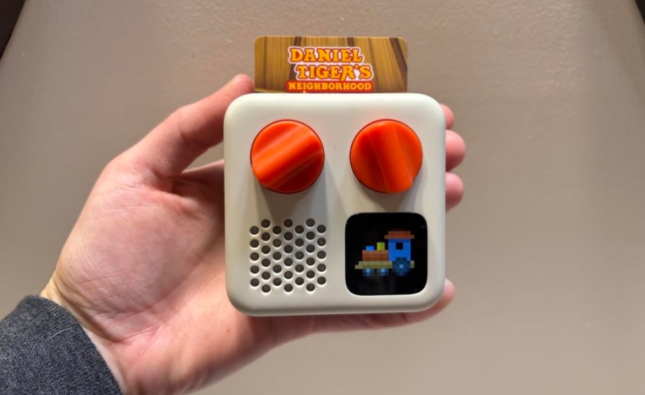 hand holding a yoto mini toy