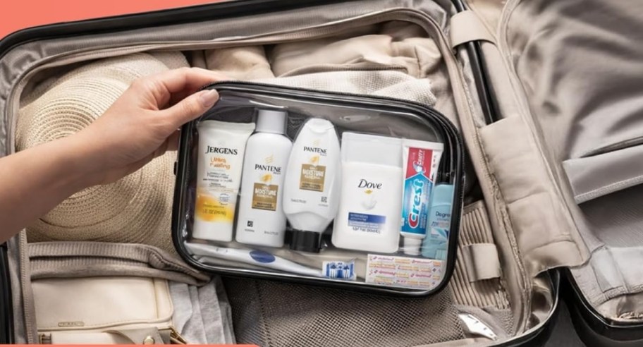 a travel toiletry bag stashed in a suitcase