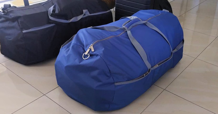 Blue duffel bag on tile floor