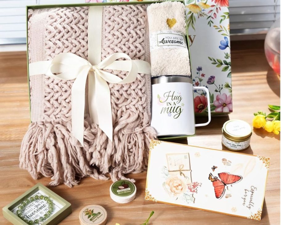 This Amazon self-care gift box set includes a blanket, mug, body care, bracelet, and more.