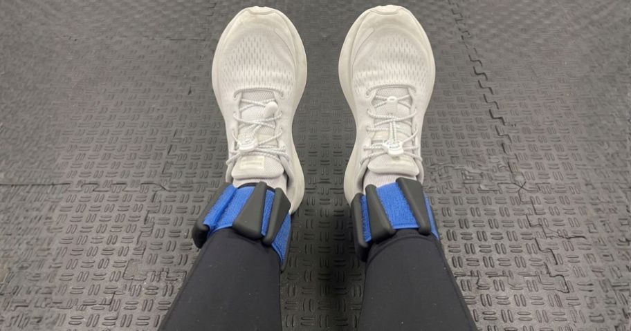 woman wearing BECOJADDE Ankle Weights in Black Blue at gym