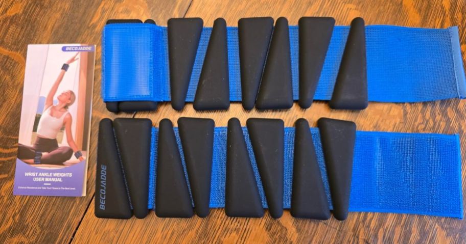 BECOJADDE Ankle Weights in Black Blue spread out on table