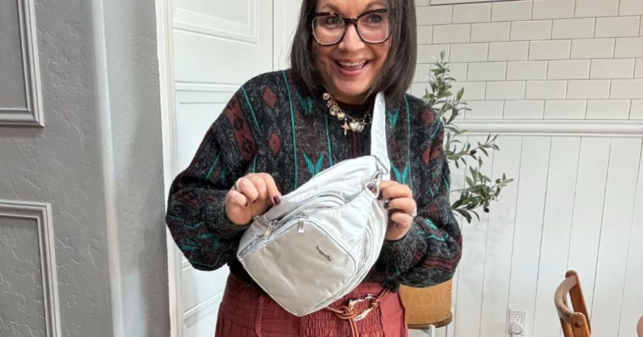 Woman wearing a Baggallini Central Park Sling Bag