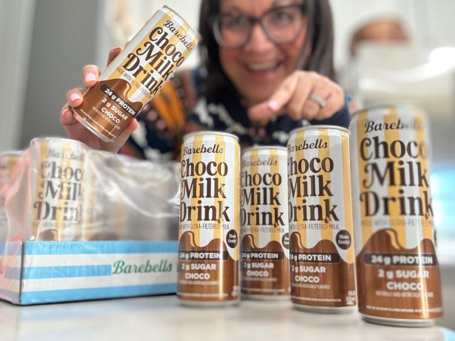 Woman with a case of Barebells Protein Choco Milk